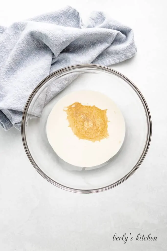 Maple syrup and other ingredients in a mixing bowl.