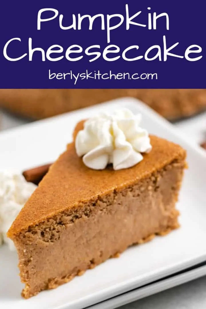 A slice of pumpkin cheesecake on a square plate.