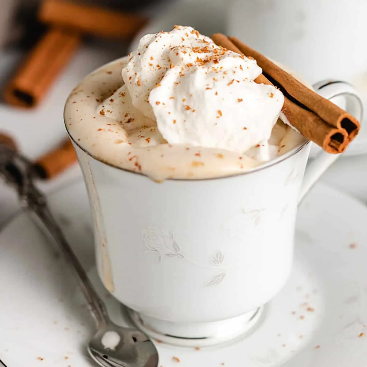 Pumpkin spice creamer mixed with coffee in a cup.