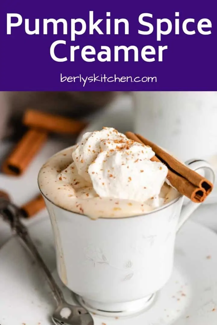 Coffee flavored with pumpkin spice creamer and garnished with a cinnamon stick.