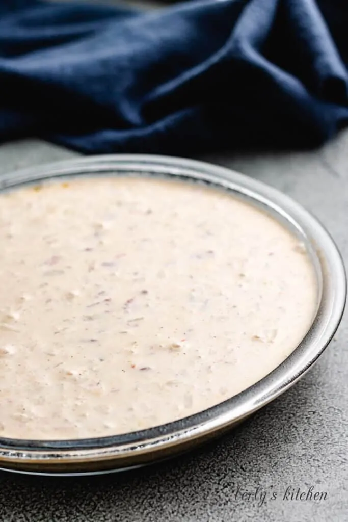 The batter has been moved to the pie pan.