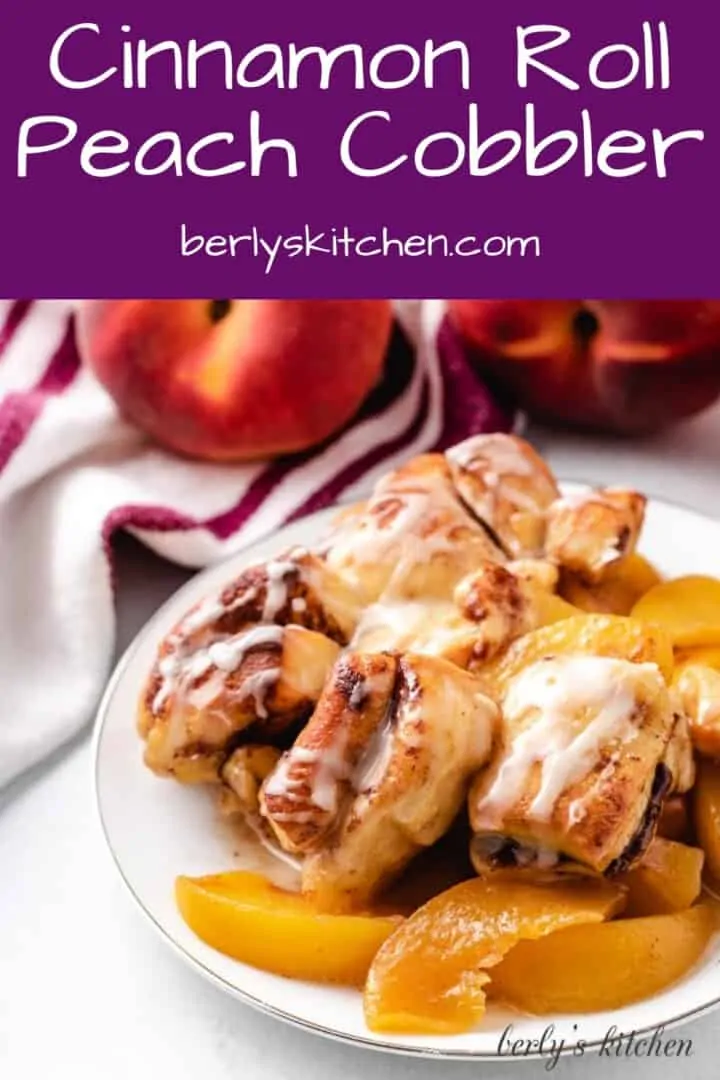 A scoop of cinnamon roll peach cobbler on a plate.