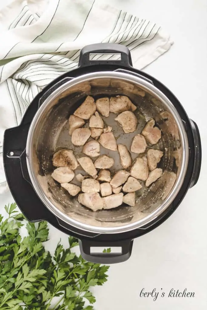 Chicken pieces in an instant pot.