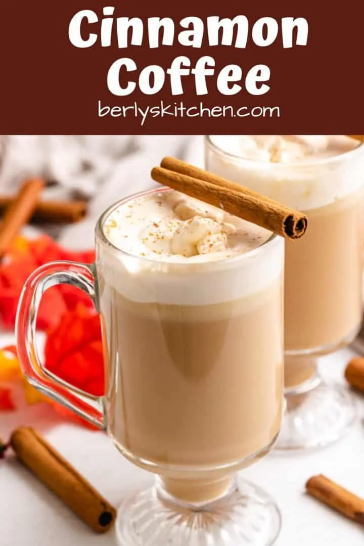 Two mugs of cinnamon coffee garnished with cinnamon sticks.