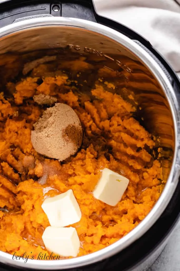 Butter and spices added to the mashed potatoes.