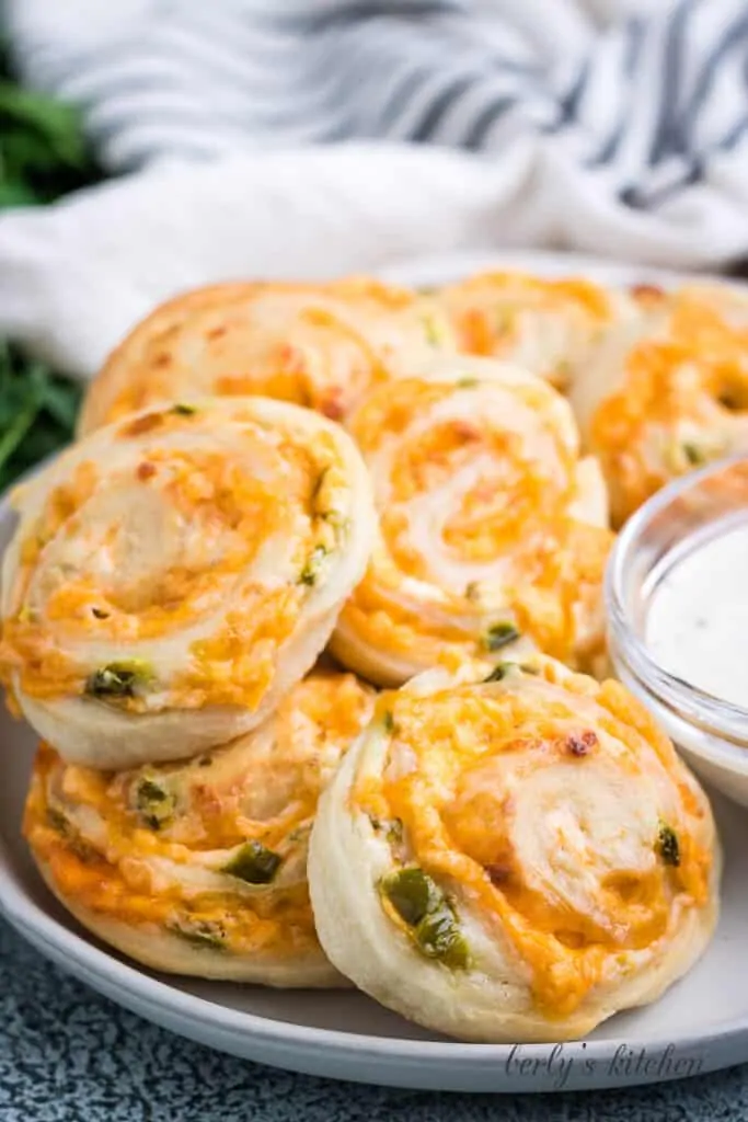 The finished popper rolls served with ranch dressing.