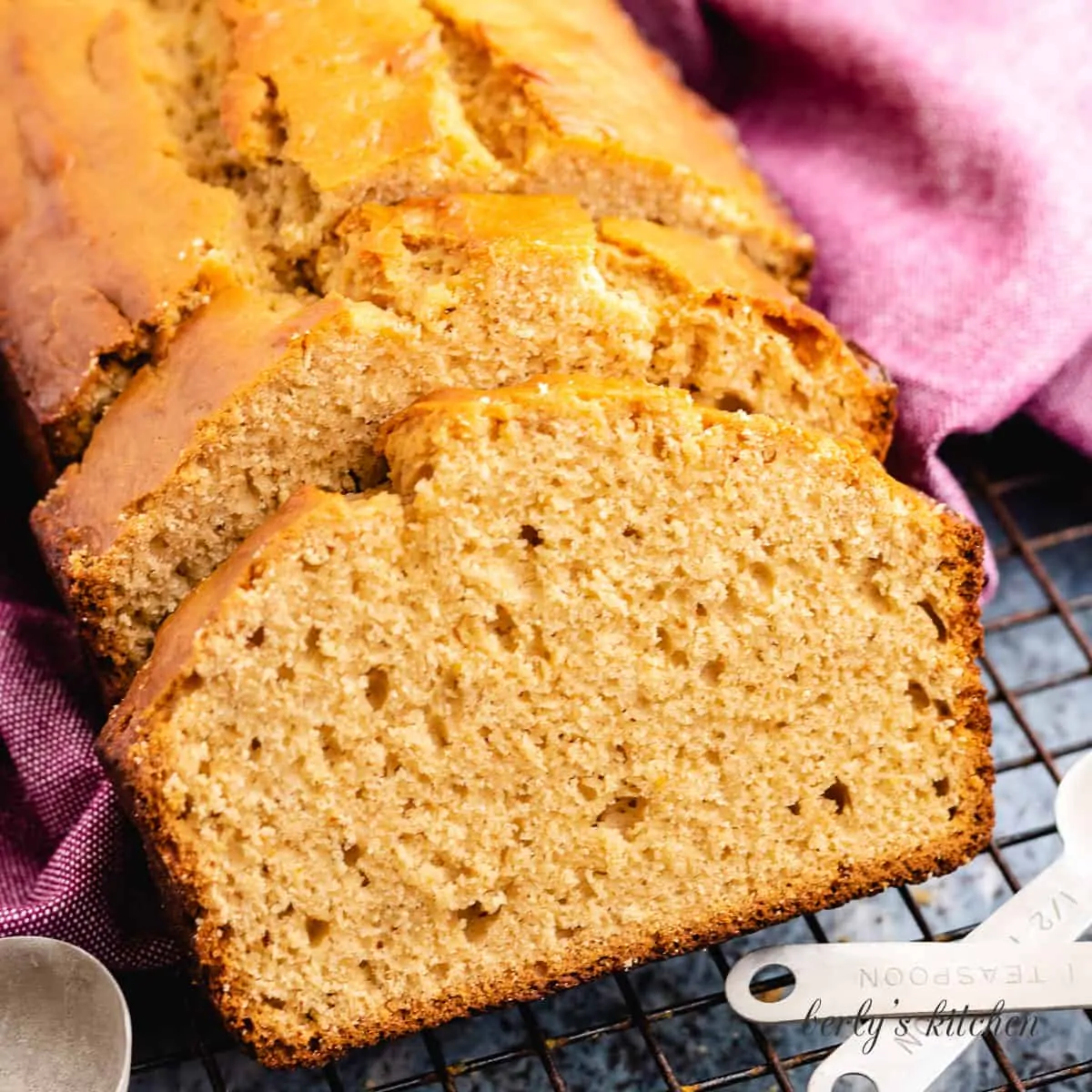 A loaf of peanut butter bread sliced for serving.