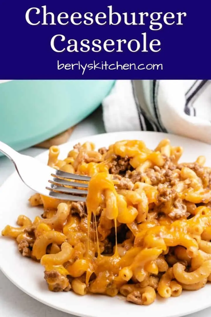 A fork lifting some cheeseburger casserole from the plate.