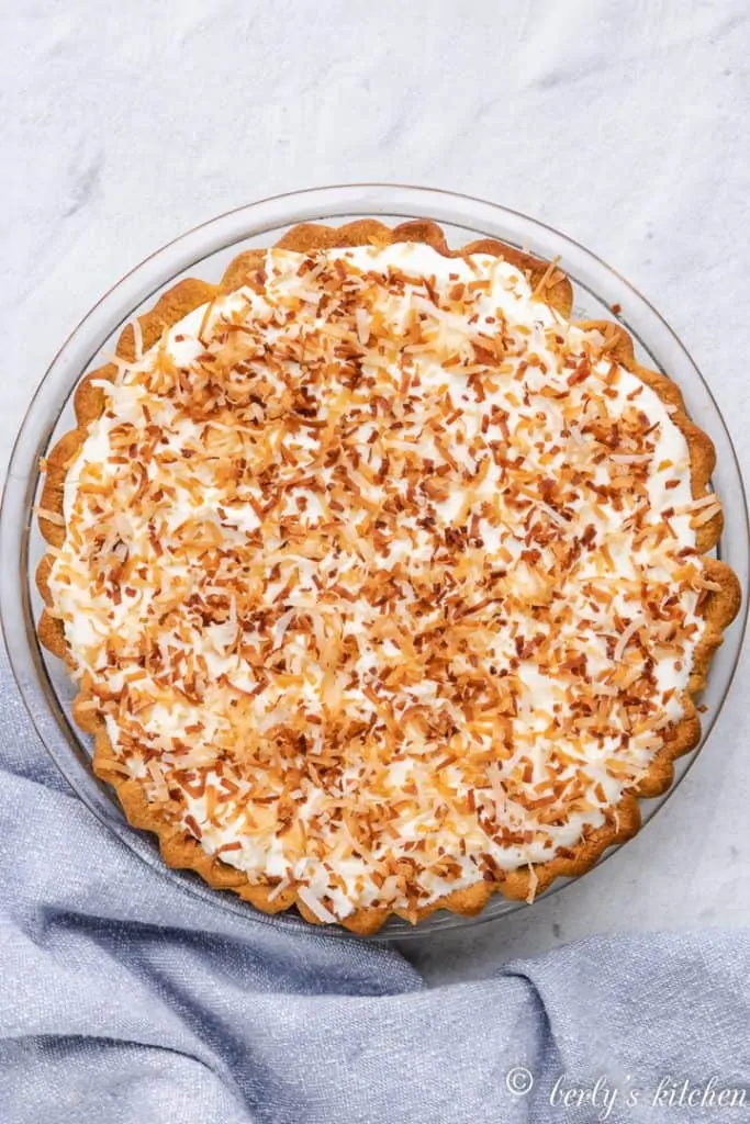 Aerial view of the finished pie topped with toasted coconut.