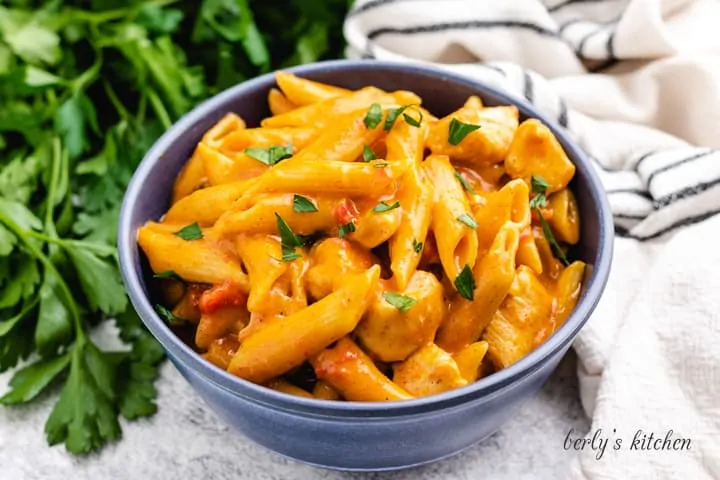 King ranch chicken pasta served in a blue bowl.