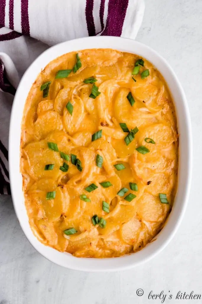 An aerial view of the baked potatoes in the casserole dish.