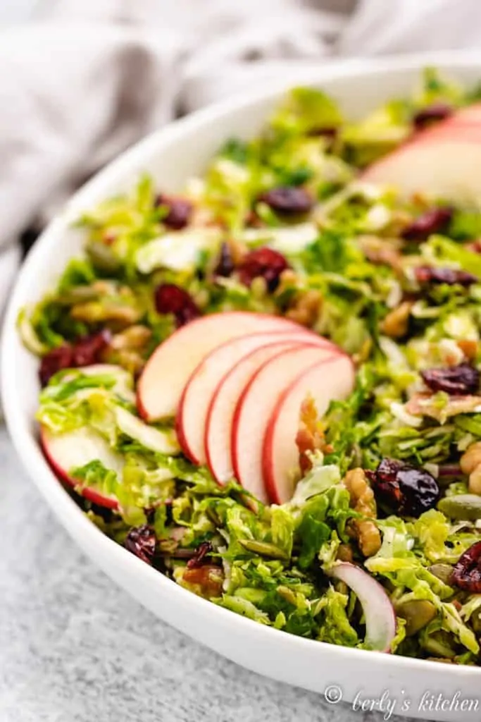 A close-up view of the apple-topped salad.