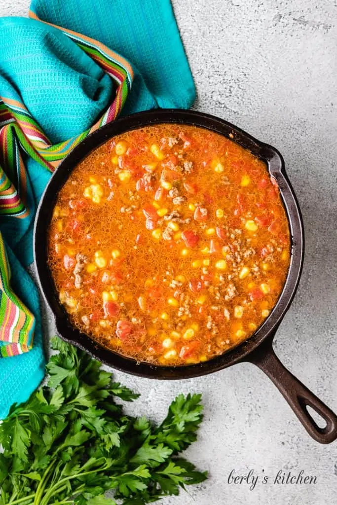 Taco seasoning, water, and other ingredients added to the beef.