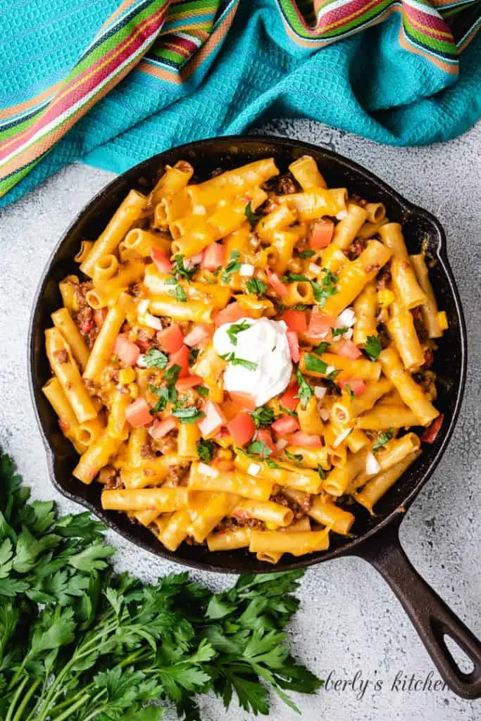 The finished pasta dish topped with sour cream.