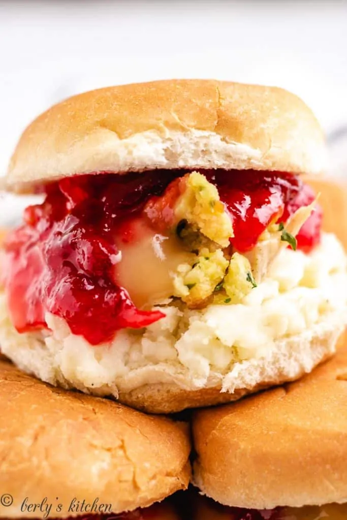 The mini sandwiches served on a decorative plate.