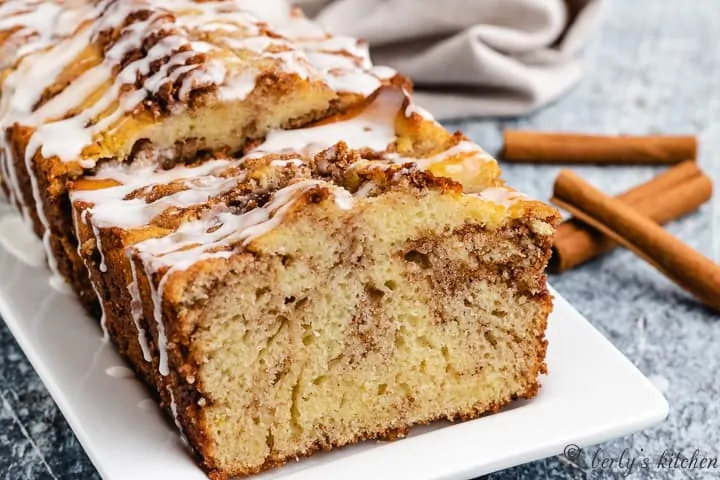 Sliced cinnamon bread served on a rectangular plate.