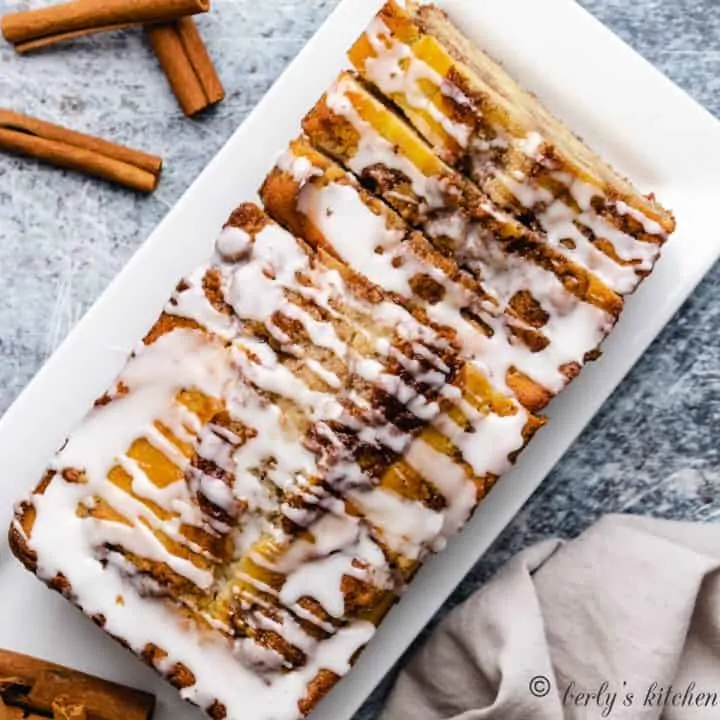 An aerial view of the cinnamon bread drizzled with glaze.