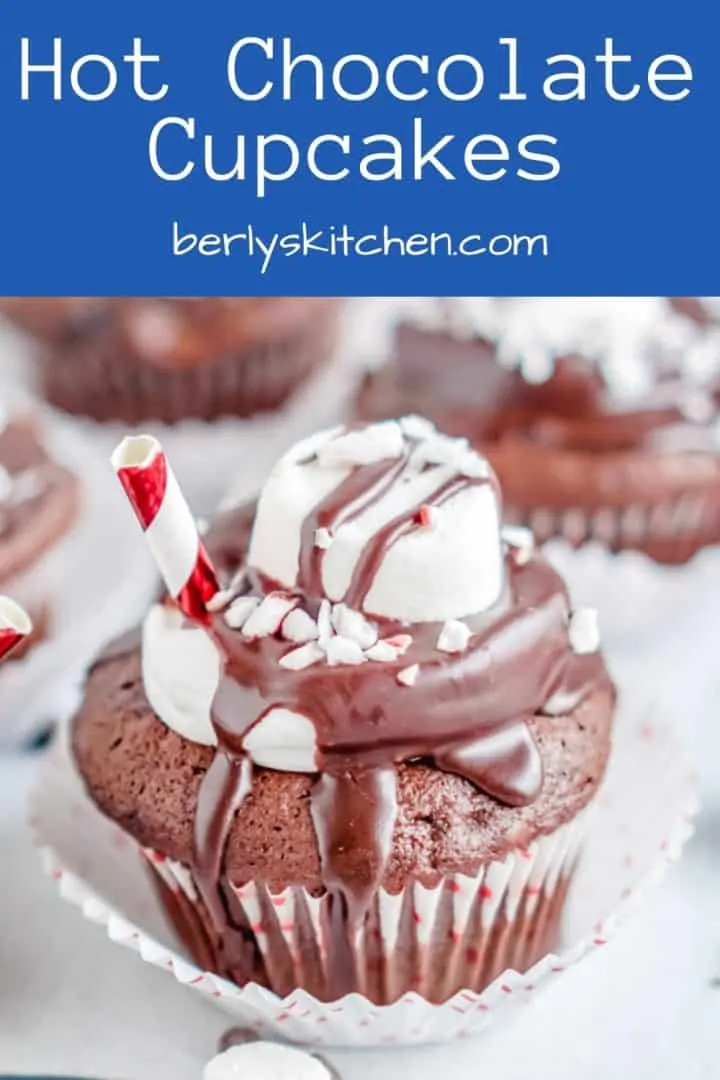 The hot chocolate cupcakes served with a holiday straw.