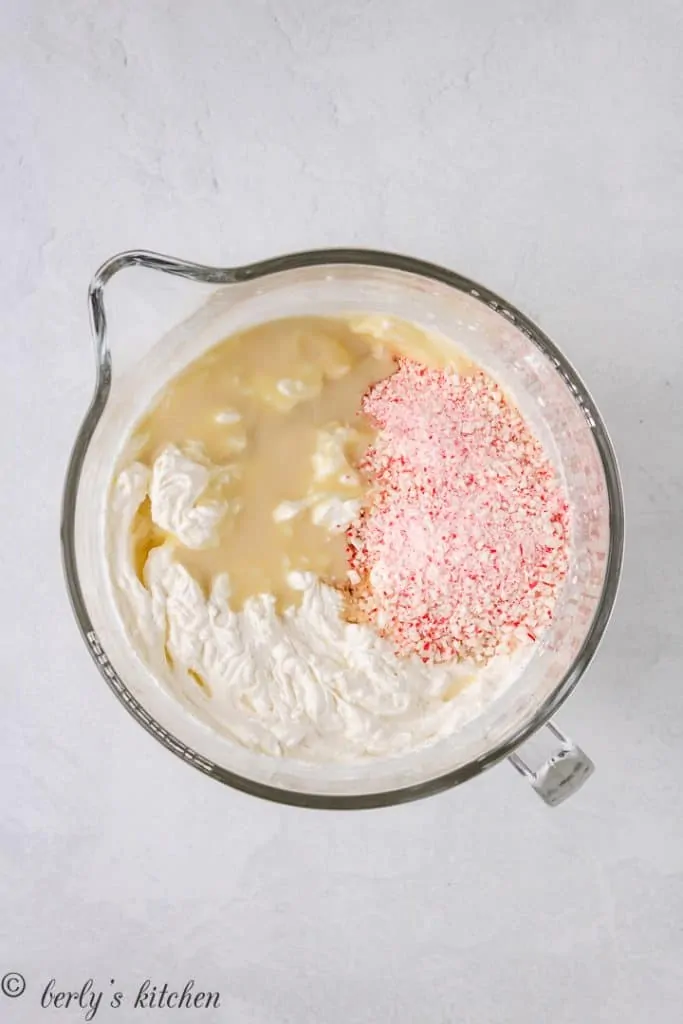 Ground peppermint candy and other ingredients in a mixing bowl.