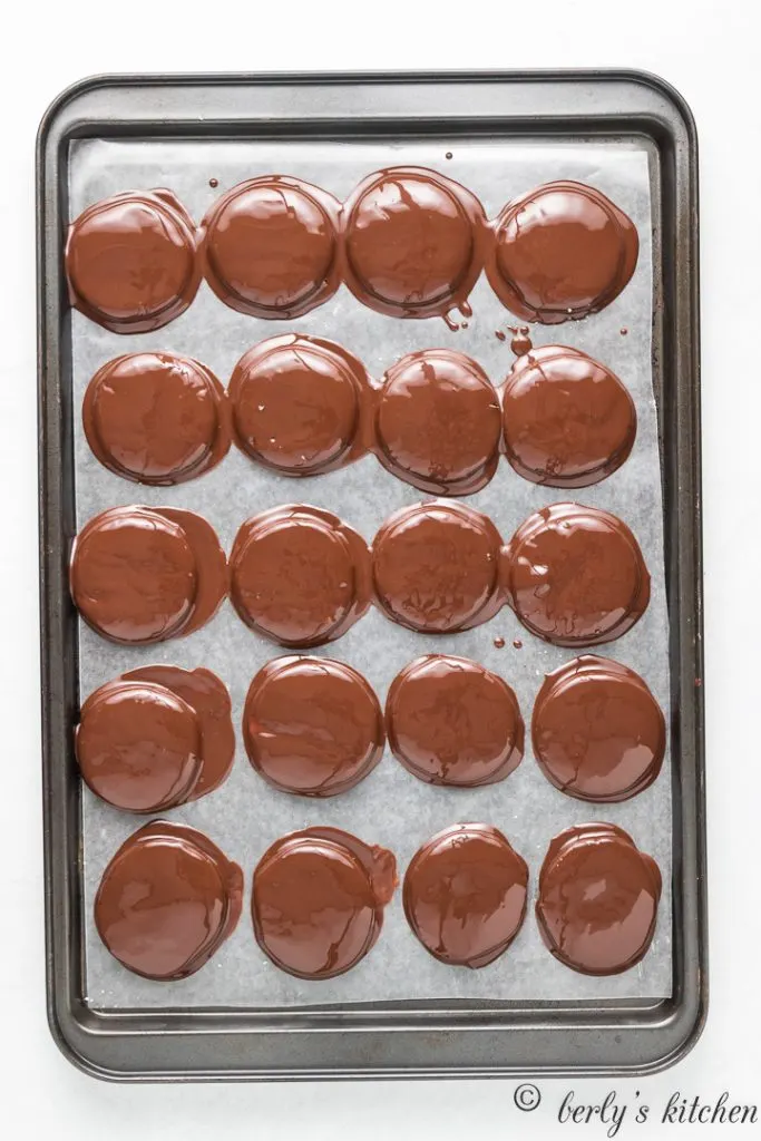 The peppermint patties topped with melted chocolate.