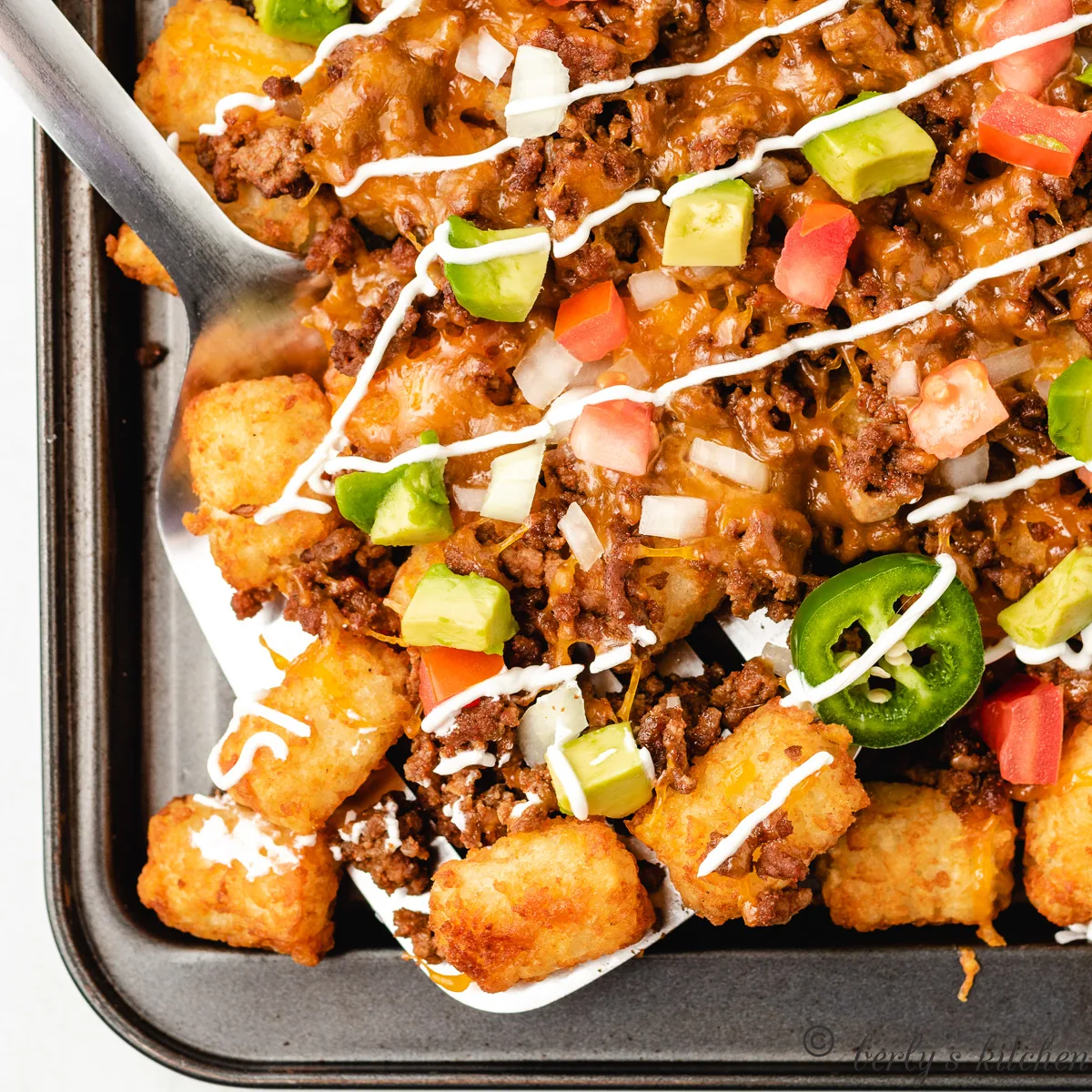 Tater tot nachos on a sheet pan.