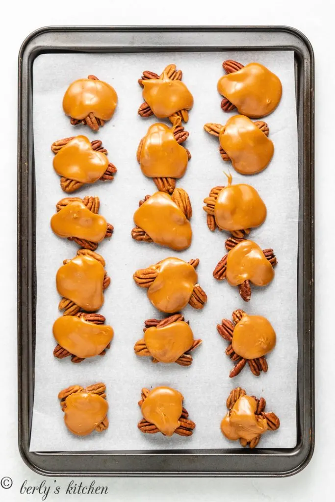 Melted caramel covering the pecan clusters.