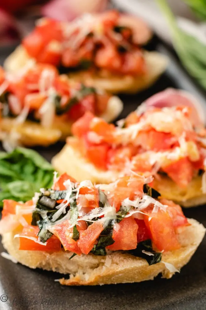 Bruschetta with tomatoes, onions, garlic, and basil on toast.