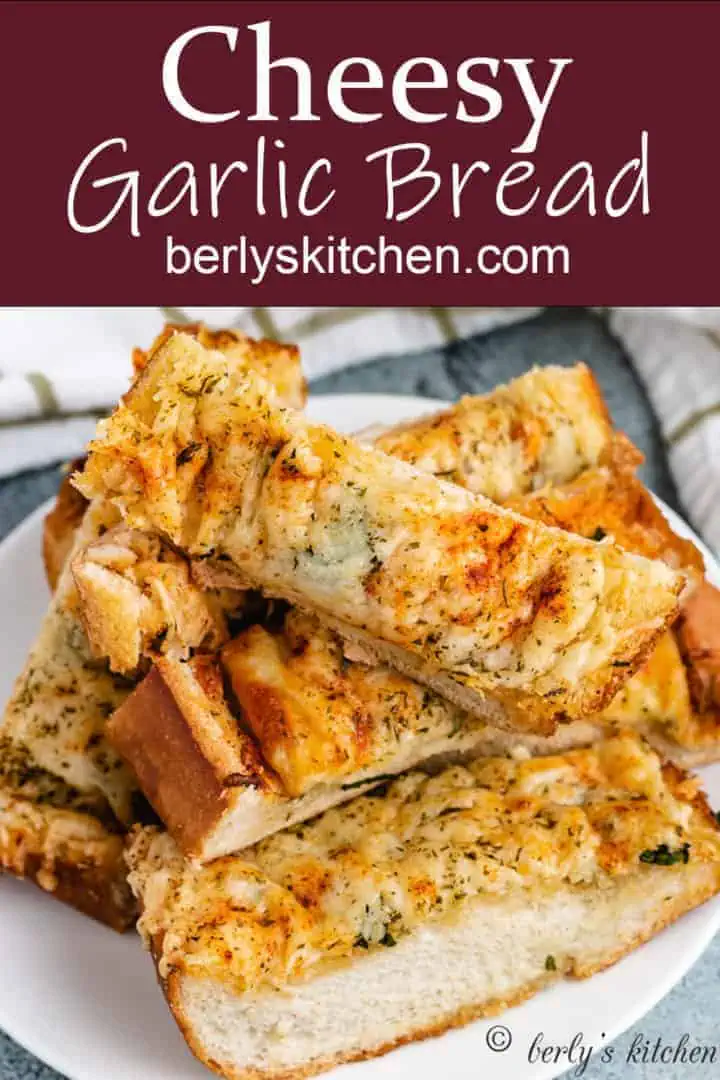 Stack of sliced garlic bread on a plate.