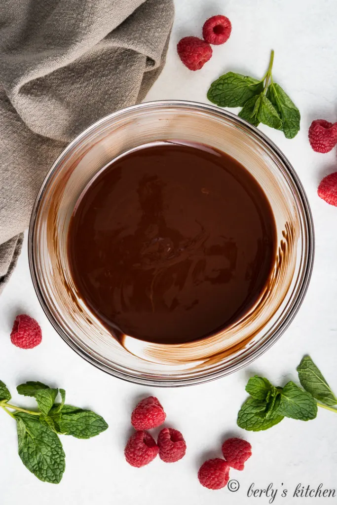 Melted chocolate and butter in a bowl.