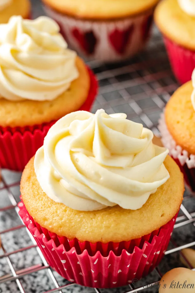 Yellow cupcake with macadamia flavor and white frosting.