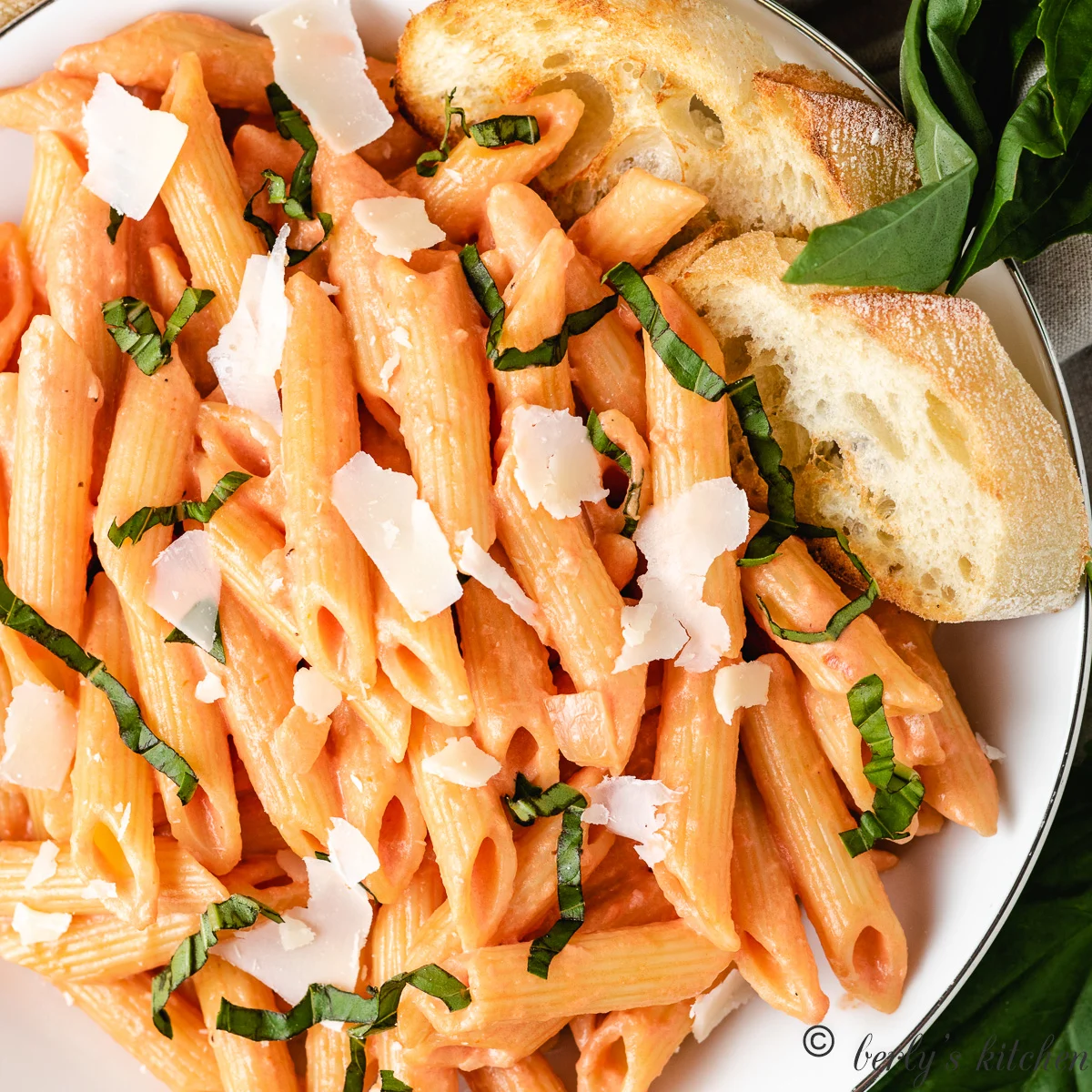 Pasta noodles, vodka sauce, basil, and parmesan cheese.