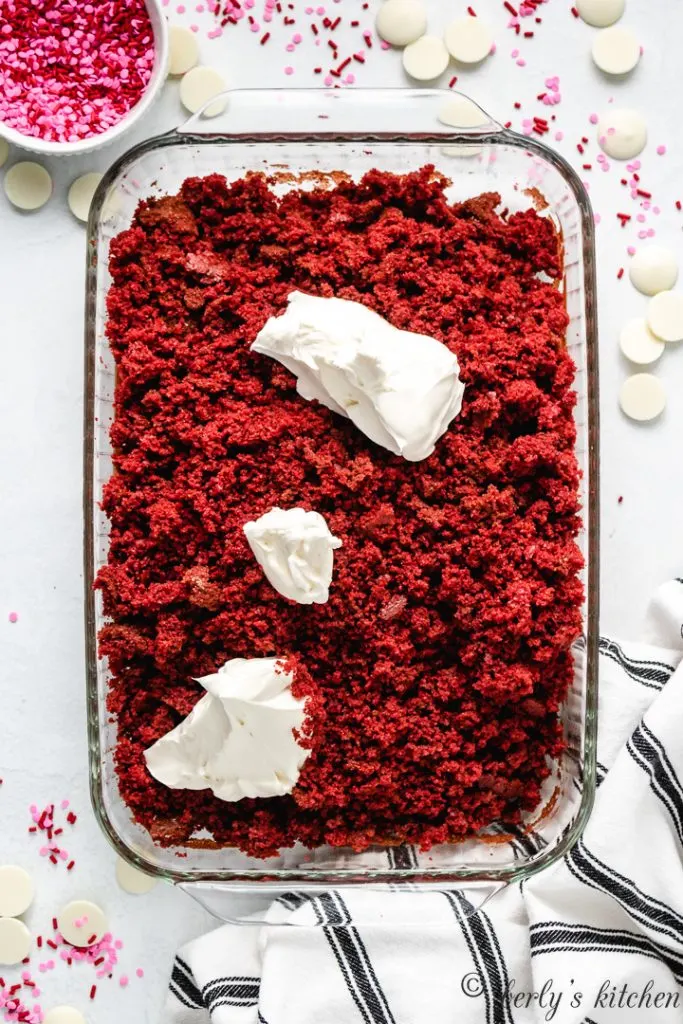 Red velvet cake broken into crumbs with cream cheese.