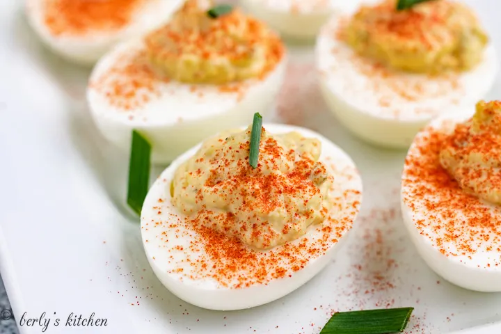 Deviled eggs with sprinkled paprika pepper.