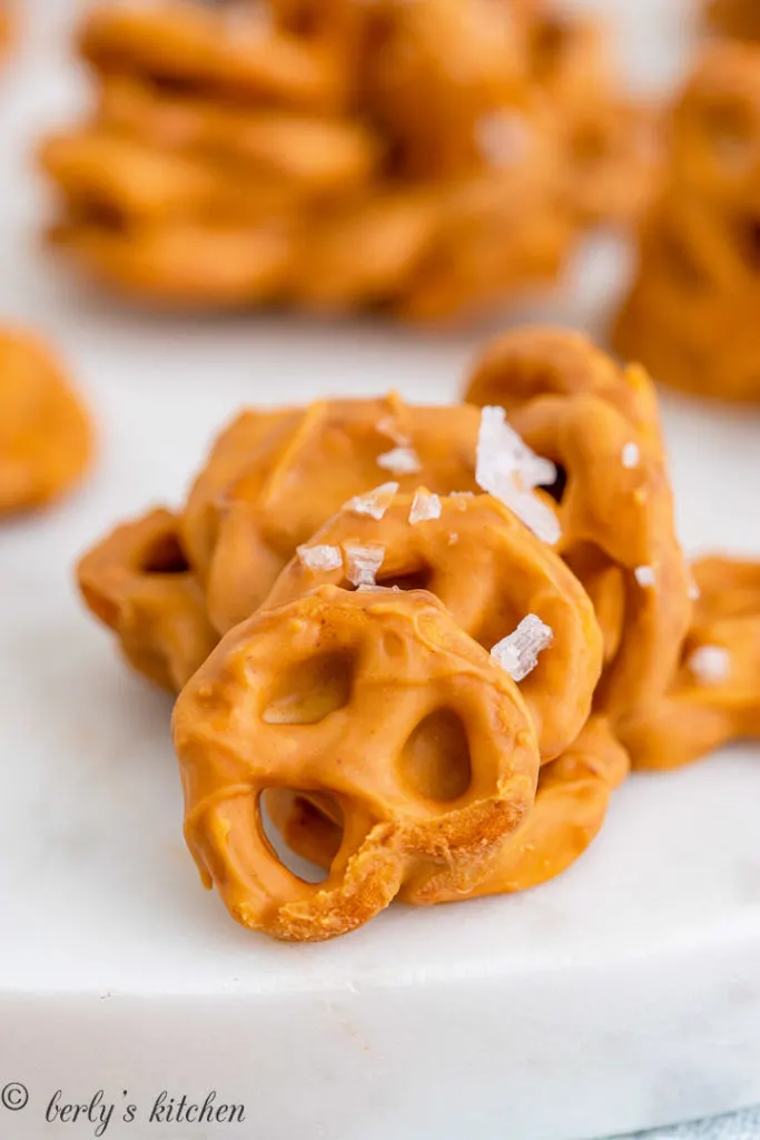 Clump of peanut butter cookies with pretzels and salt.