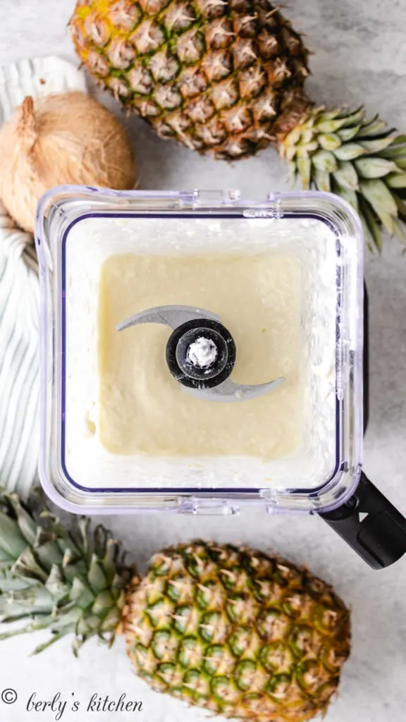 Top down view of a smoothie in a blender.