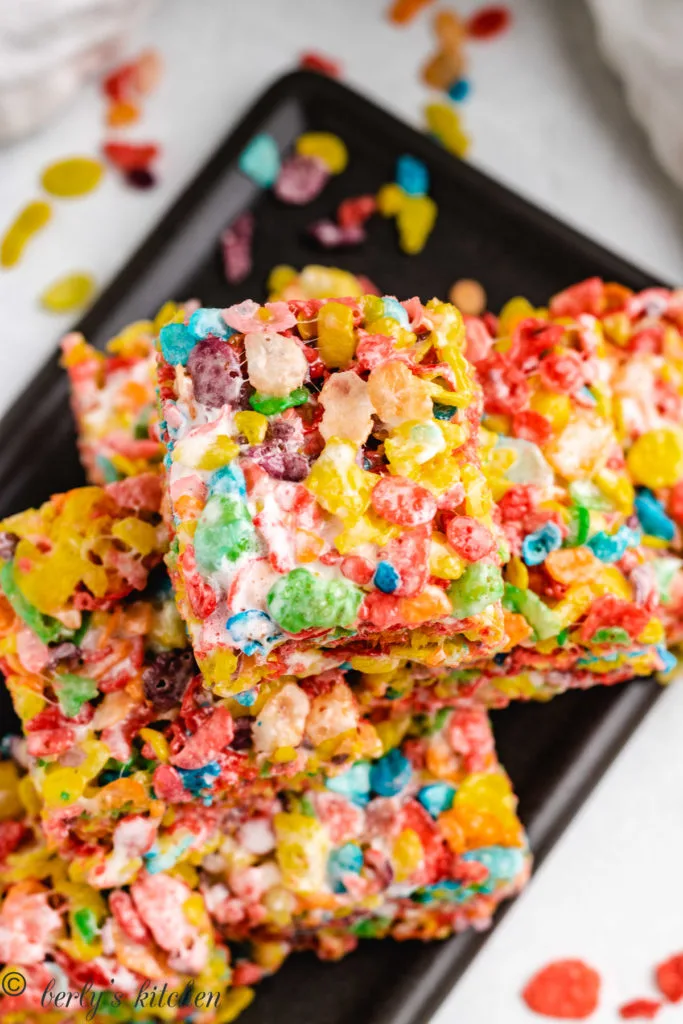 Top down view of fruity pebbles treats on a plate.