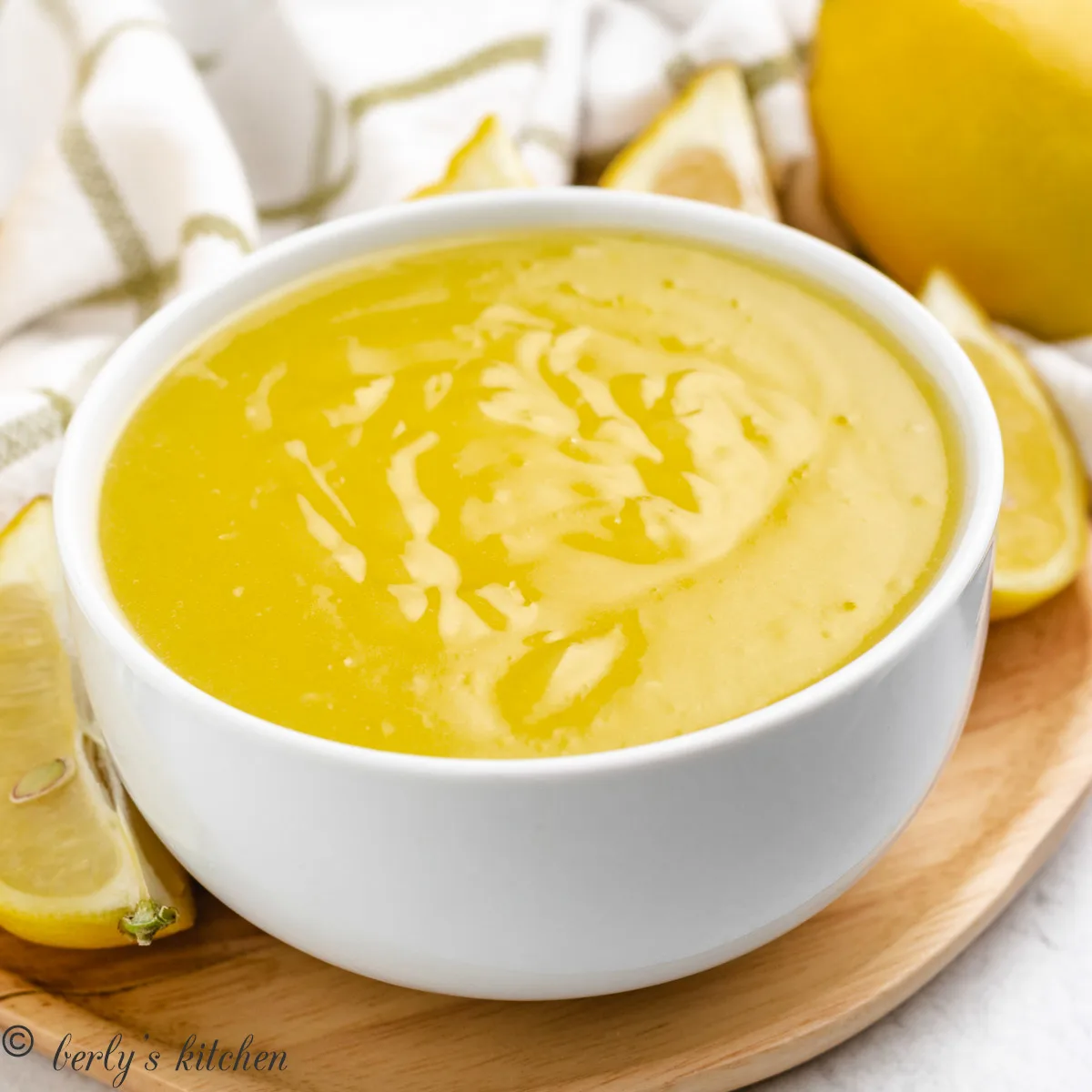 White bowl full of lemon curd.