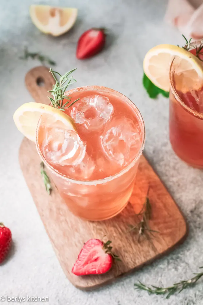 Top down view of strawberry drinks in glasses.