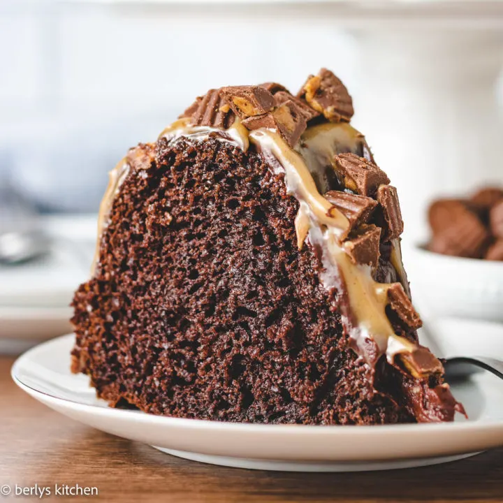 Slice of chocolate bundt cake with peanut butter sauce.