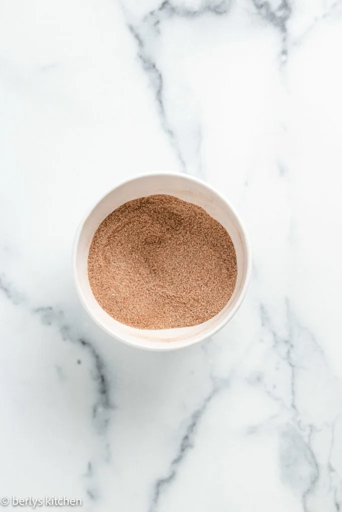 Top down view of mixed cinnamon sugar in a bowl.