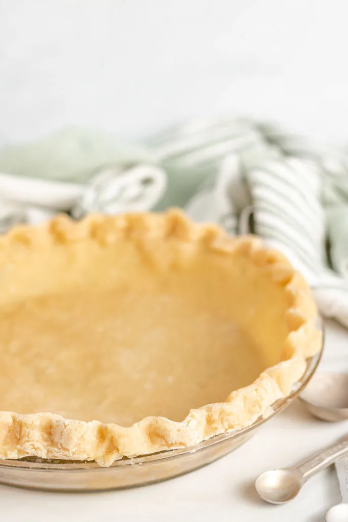 Unbaked pie crust in a pie dish.