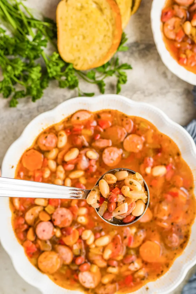 Top down view of soup with beans.