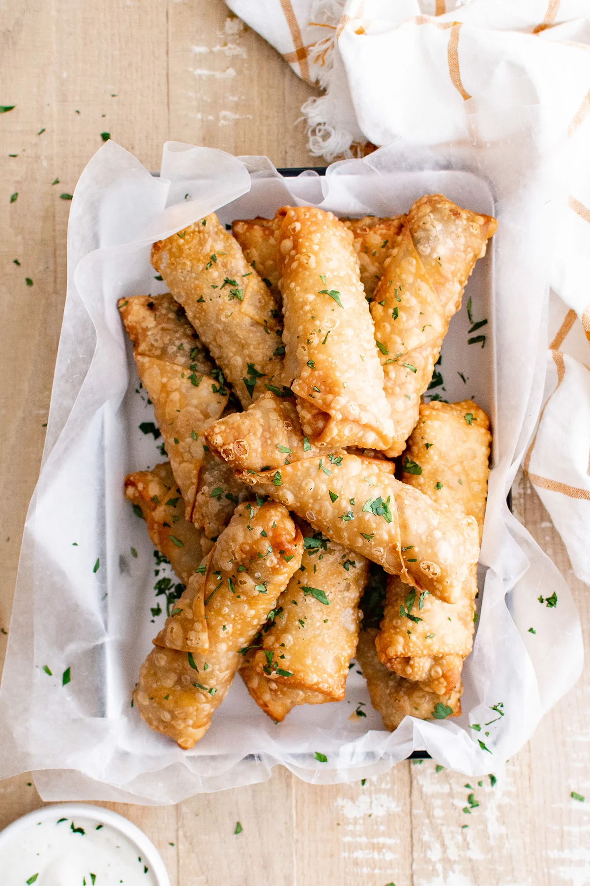 Top down view of egg rolls on a platter.