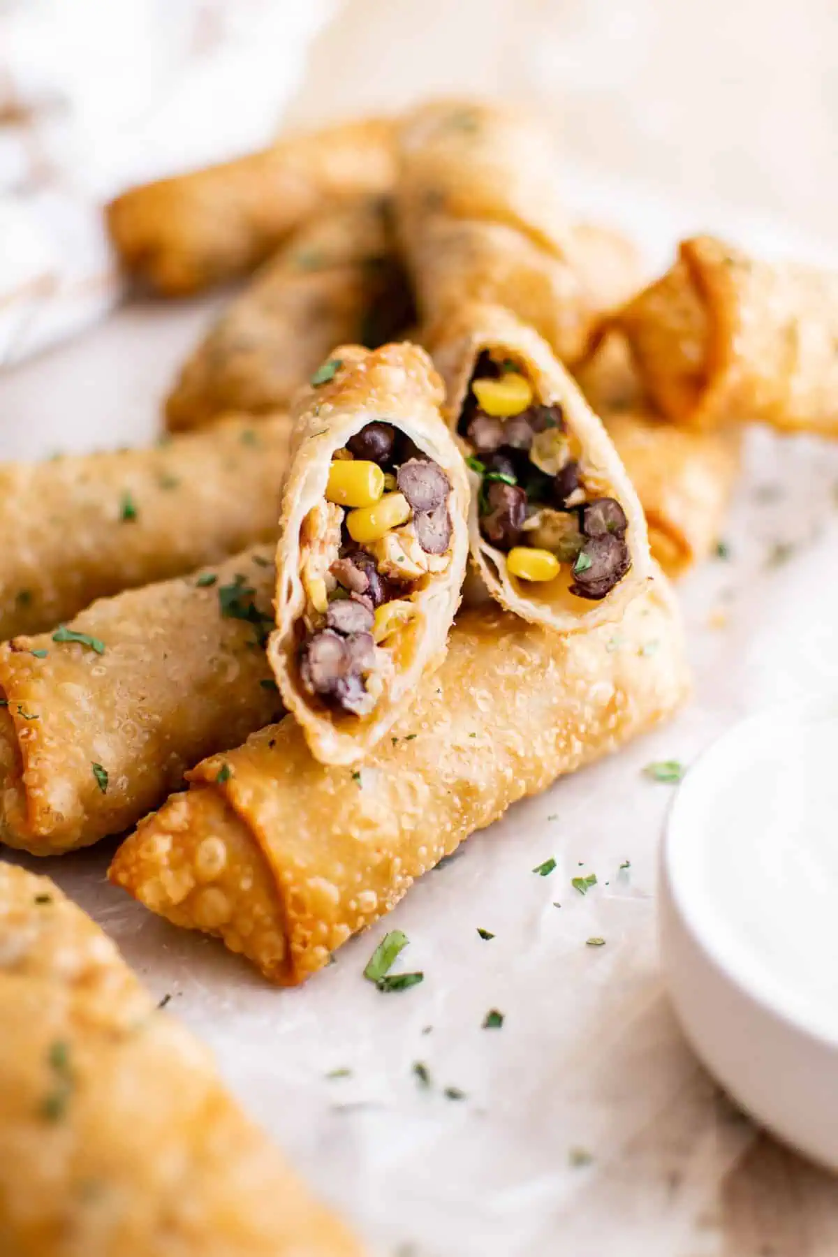 Top down view of an egg roll cut on diagonal.