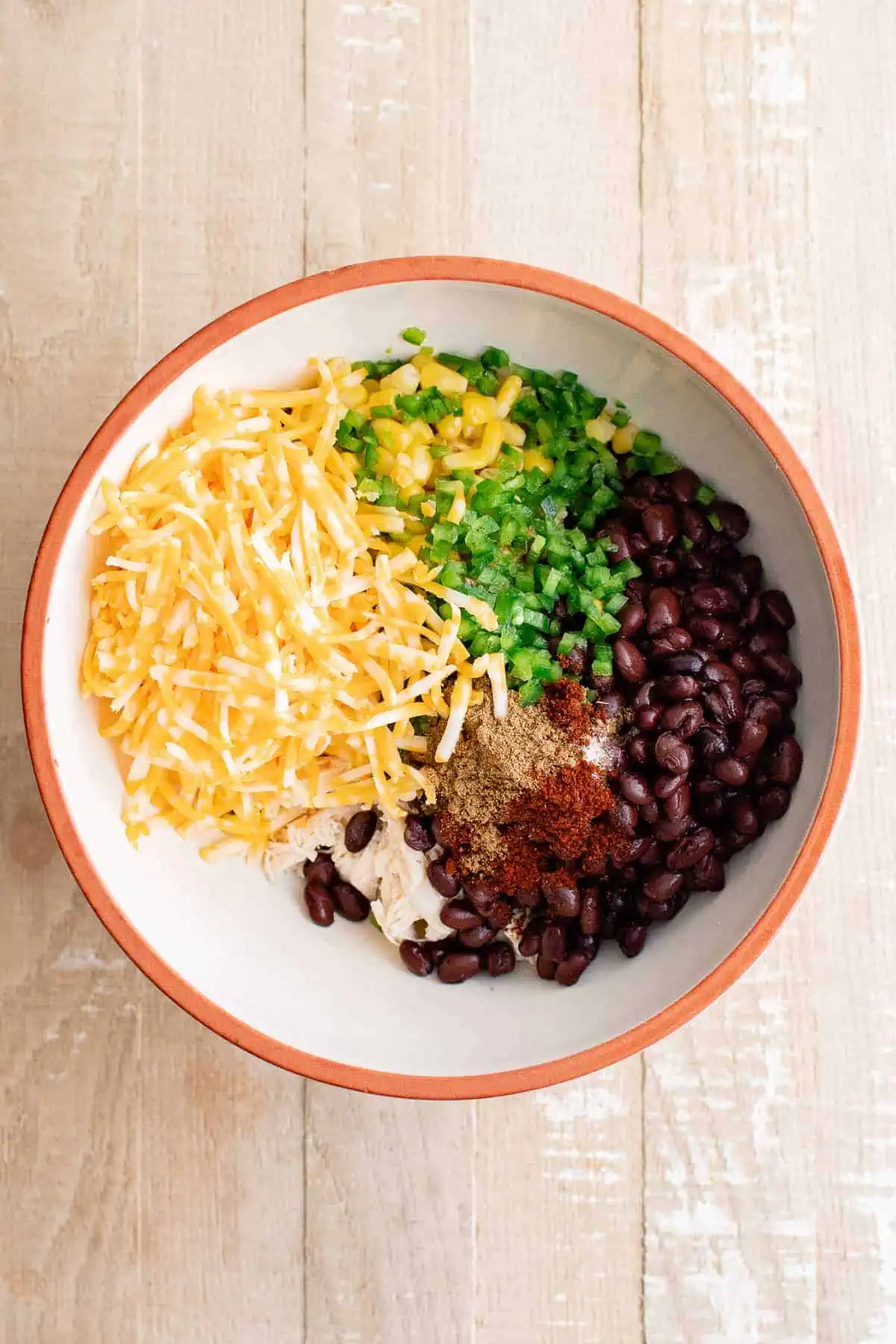 Top down view of ingredients for egg roll filling in a bowl.