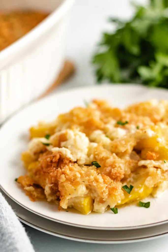 Squash casserole on a white plate.