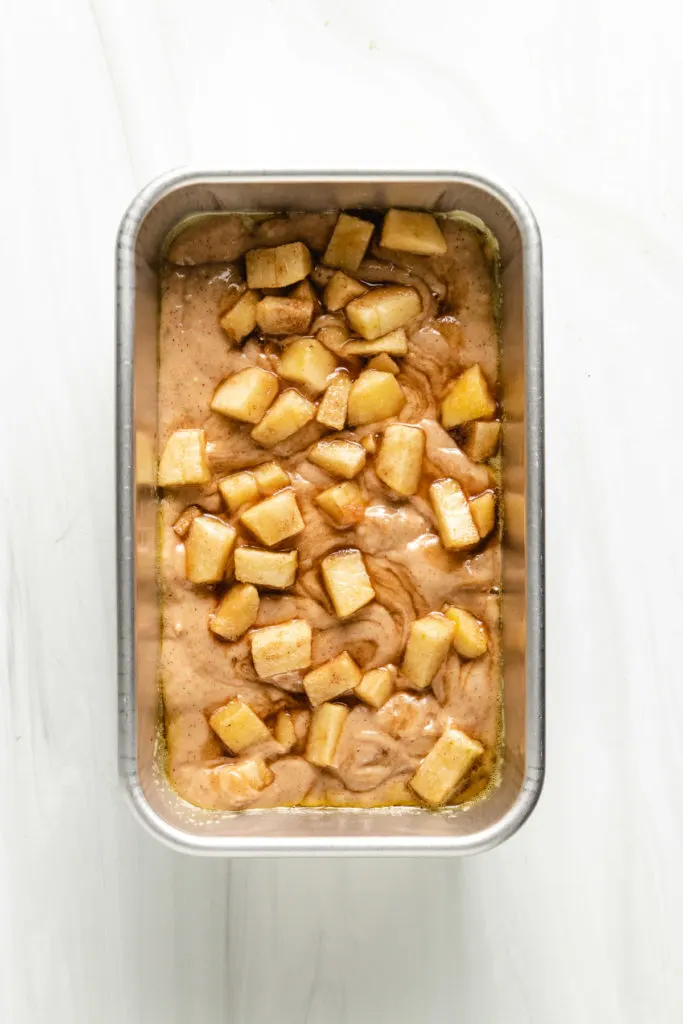 Top down view of unbaked apples swirled bread.