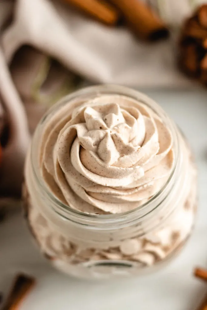 Pumpkin spice whipped cream in a mason jar.