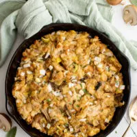 Top down view of sage stuffing in cast iron.