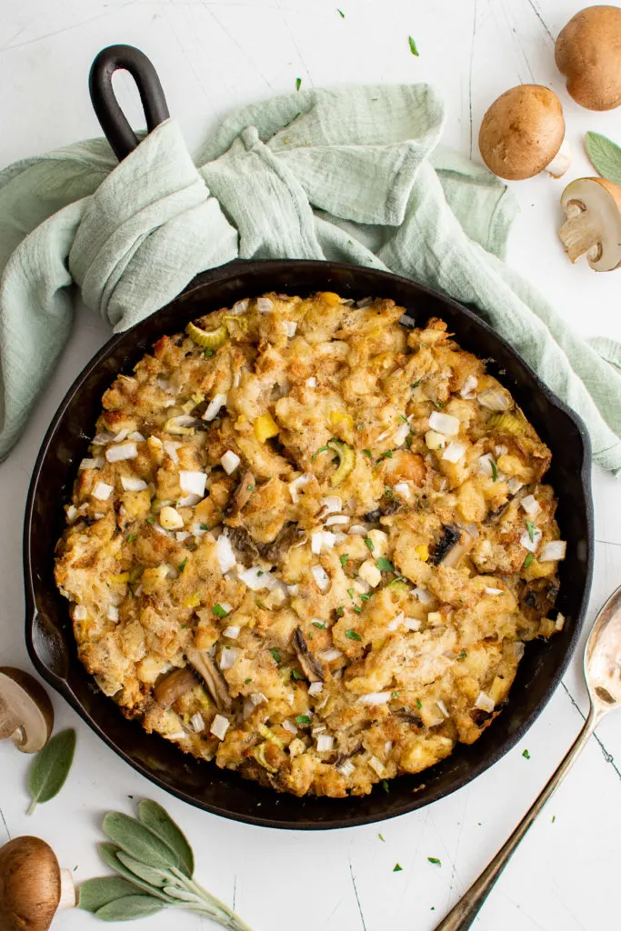 Top down view of sage stuffing in cast iron.